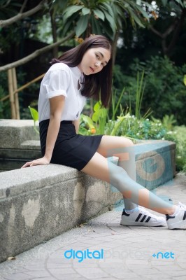 Thai Adult Student University Uniform Beautiful Girl Relax And Smile Stock Photo