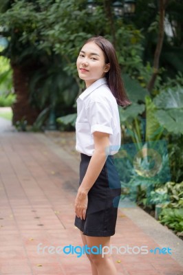 Thai Adult Student University Uniform Beautiful Girl Relax And Smile Stock Photo