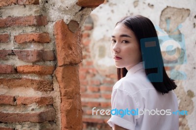 Thai Adult Student University Uniform Beautiful Girl Relax And Smile Stock Photo