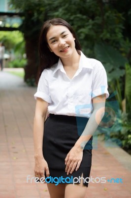 Thai Adult Student University Uniform Beautiful Girl Relax And Smile Stock Photo