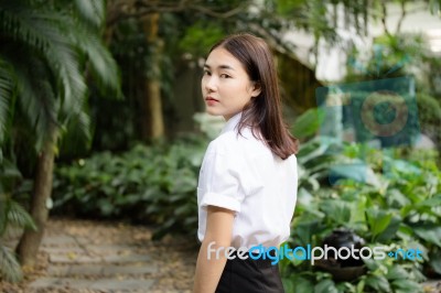 Thai Adult Student University Uniform Beautiful Girl Relax And Smile Stock Photo