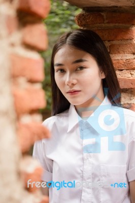 Thai Adult Student University Uniform Beautiful Girl Relax And Smile Stock Photo