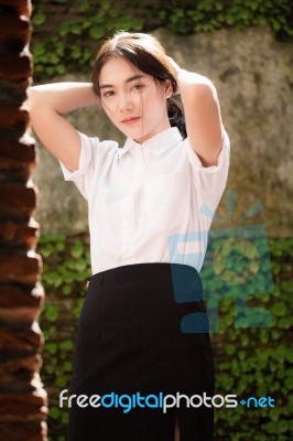 Thai Adult Student University Uniform Beautiful Girl Relax And Smile Stock Photo