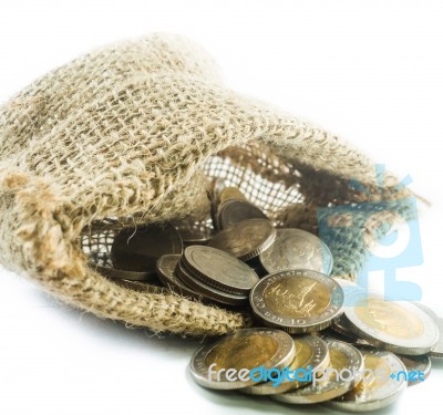 Thai Baht Coins In A Small Sack On A White Background Stock Photo