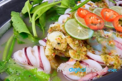 Thai Food Name Is Steamed Squid With Lemon Stock Photo