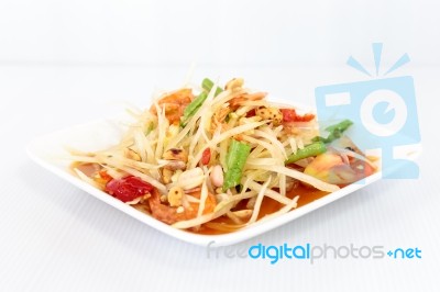 Thai Food Papaya Salad On White Dish Stock Photo