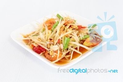 Thai Food Papaya Salad On White Dish Stock Photo