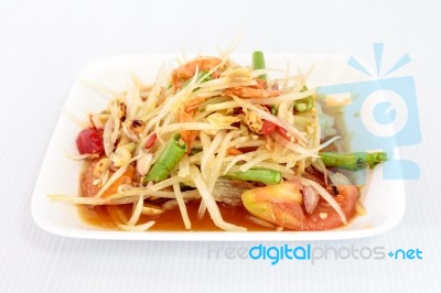 Thai Food Papaya Salad On White Dish Stock Photo