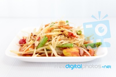 Thai Food Papaya Salad On White Dish Stock Photo