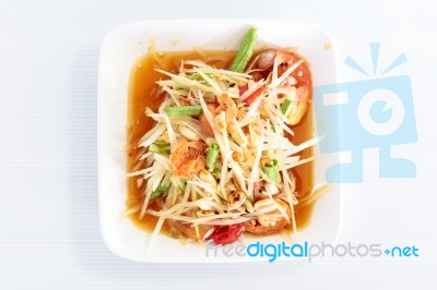 Thai Food Papaya Salad On White Dish Stock Photo