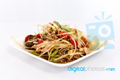 Thai Food Papaya Salad On White Dish Stock Photo