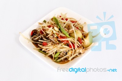 Thai Food Papaya Salad On White Dish Stock Photo