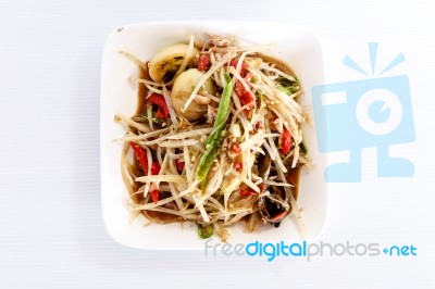 Thai Food Papaya Salad On White Dish Stock Photo