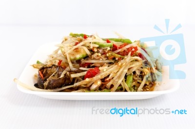 Thai Food Papaya Salad On White Dish Stock Photo