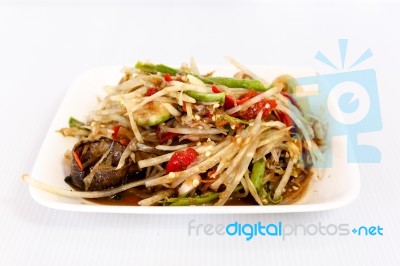 Thai Food Papaya Salad On White Dish Stock Photo