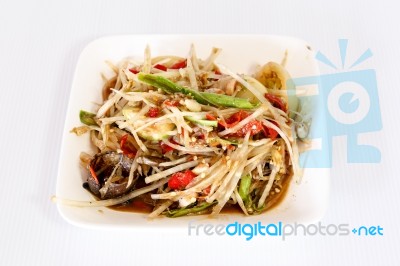 Thai Food Papaya Salad On White Dish Stock Photo