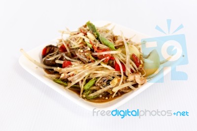 Thai Food Papaya Salad On White Dish Stock Photo