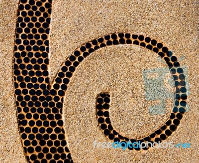 The Abstract Ceramic Spiral On Pebble Background Stock Photo