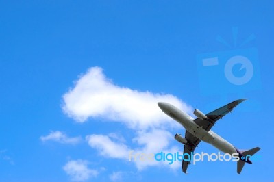 The Airplane On The Sky Stock Photo