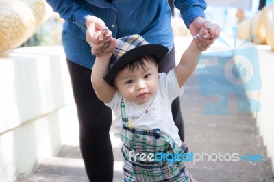 The Baby With The Mom Stock Photo