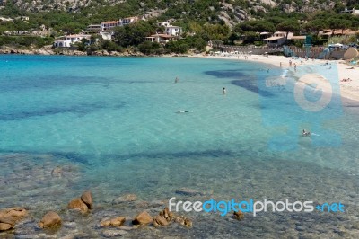 The Beach At Baja Sardinia Stock Photo