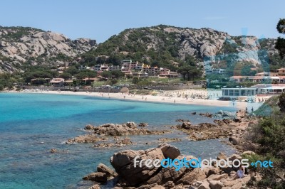 The Beach At Baja Sardinia Stock Photo