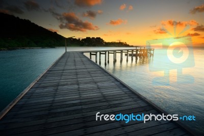 The Beautiful Wooden Bridge With Sunrise At National Park Stock Photo