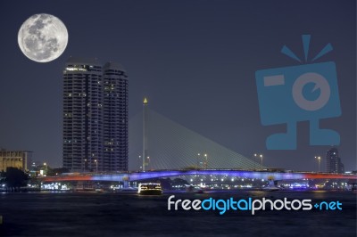 The Beauty Of The Full Moon At Chao Phraya River And Pinklao Bridge , Bangkok Thailand Stock Photo