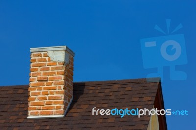 The Brick Chimney In Bright Sunlight A Deep Blue Sky Horizontal Stock Photo