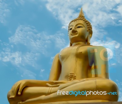 The Buddha Status On Blue Sky Background Stock Photo