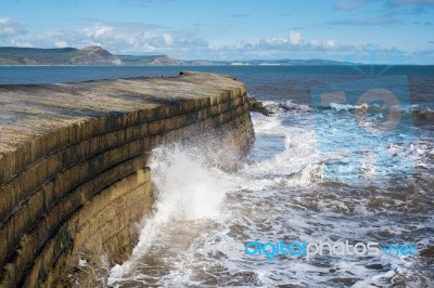 The Cobb Harbour Wall In Lyme Regis Stock Photo