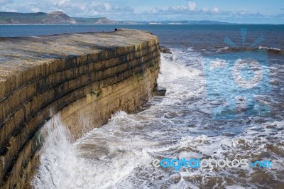 The Cobb Harbour Wall In Lyme Regis Stock Photo