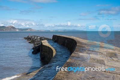 The Cobb Harbour Wall In Lyme Regis Stock Photo