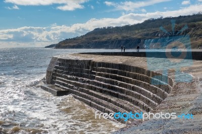 The Cobb Harbour Wall In Lyme Regis Stock Photo