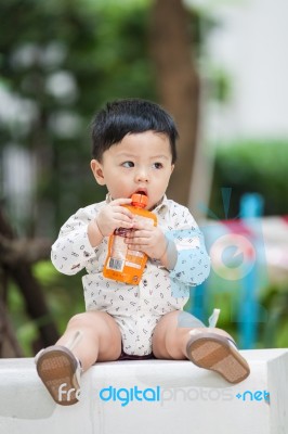 The Cute Boy In The Garden Stock Photo