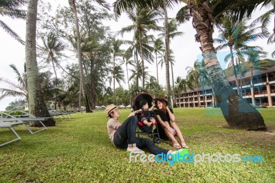 The Family Having Fun Together At The Beach Stock Photo