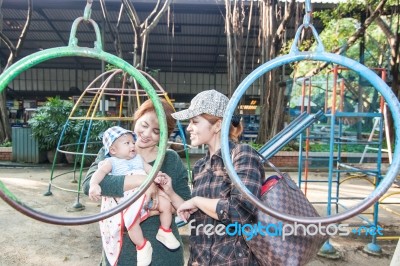 The Family In The Playground Stock Photo