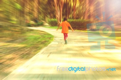 The Girl Walking In Park Stock Photo