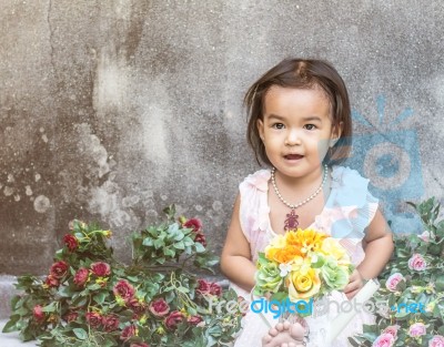 The Girl Was Sitting Among The Flowers Stock Photo