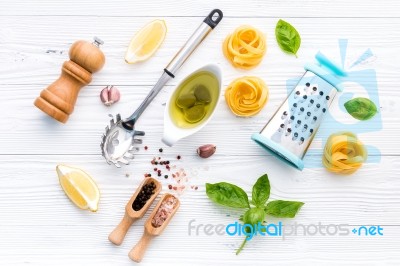 The Ingredients For Homemade Pesto Pasta On White Wooden Backgro… Stock Photo