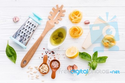 The Ingredients For Homemade Pesto Pasta On White Wooden Backgro… Stock Photo