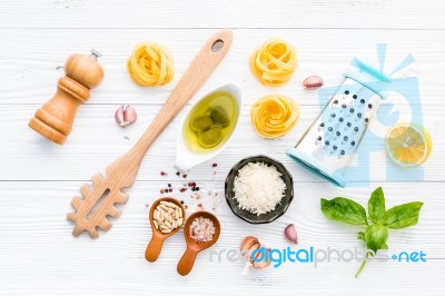 The Ingredients For Homemade Pesto Pasta On White Wooden Backgro… Stock Photo