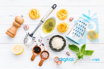 The Ingredients For Homemade Pesto Pasta On White Wooden Backgro… Stock Photo