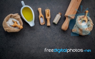 The Ingredients For Homemade Pizza Dough On Dark Stone Backgroun… Stock Photo