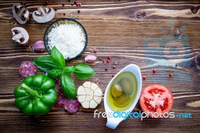 The Ingredients For Homemade Pizza On Shabby Wooden Background Stock Photo