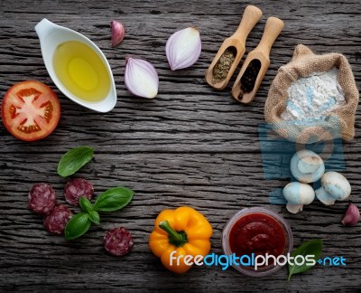 The Ingredients For Homemade Pizza On Shabby Wooden Background Stock Photo