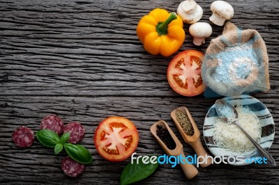 The Ingredients For Homemade Pizza On Shabby Wooden Background Stock Photo