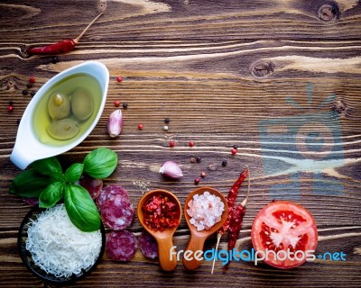 The Ingredients For Homemade Pizza On Shabby Wooden Background Stock Photo