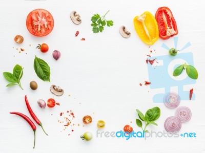 The Ingredients For Homemade Pizza On White Wooden Background Stock Photo