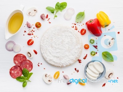 The Ingredients For Homemade Pizza On White Wooden Background Stock Photo